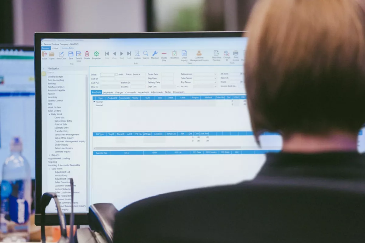 Produce company staff reviewing EDI orders